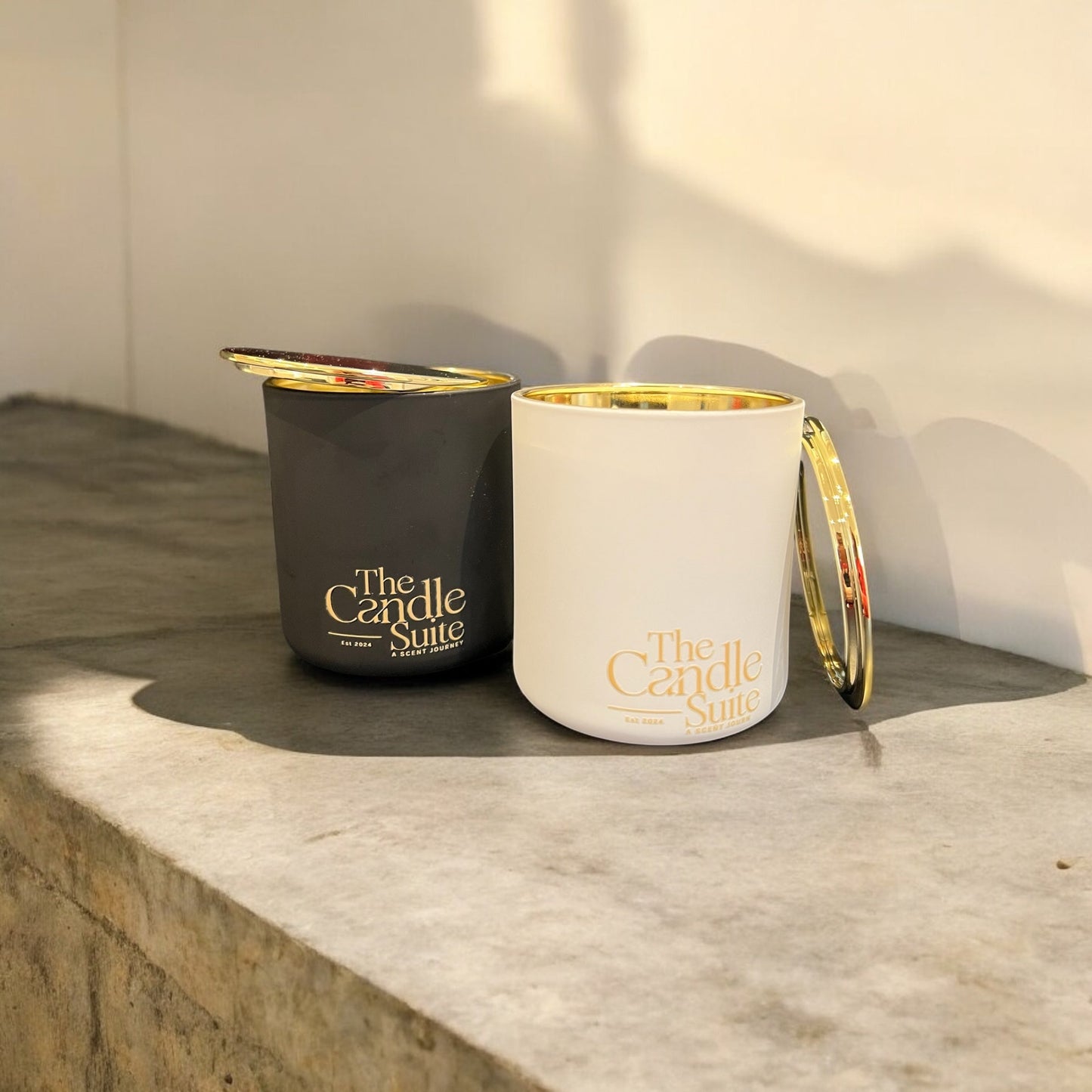 Elegant black and white jar candles, infused with high-quality scents for a luxury candle experience.