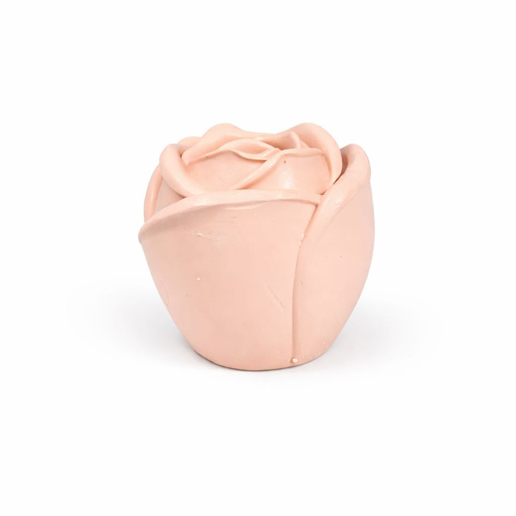 Pink rosebud-shaped candle jar on a white background