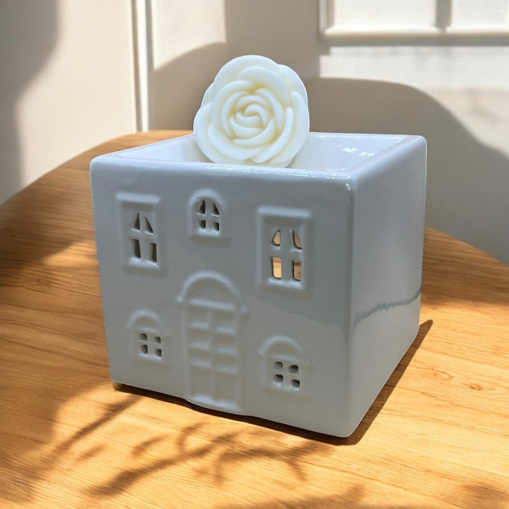 Ceramic cottage wax melt burner, designed to melt your favorite wax melts while enhancing room ambiance.