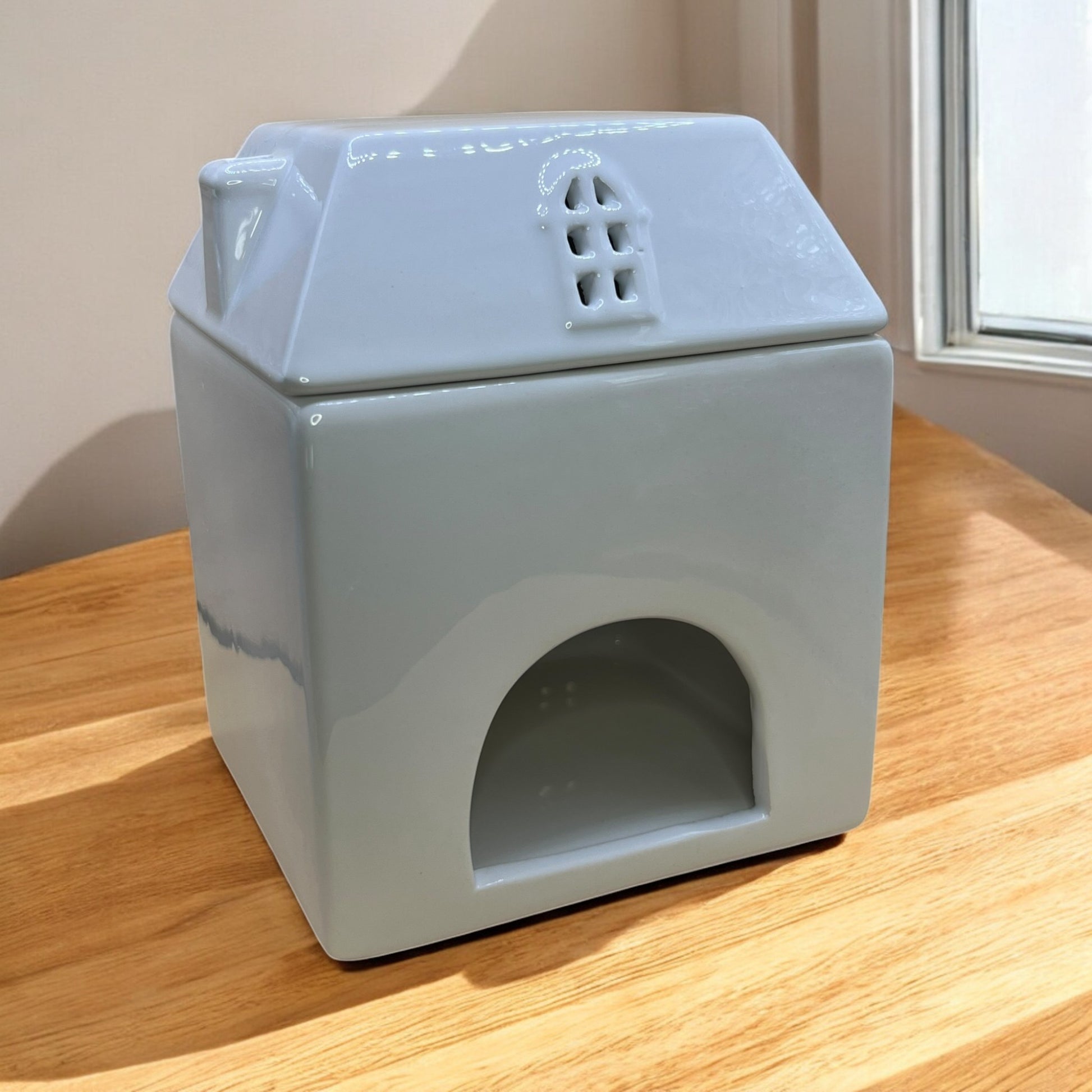 Adorable ceramic cottage wax melt burner, perfect for creating a welcoming, scented atmosphere perfect with our wax melts