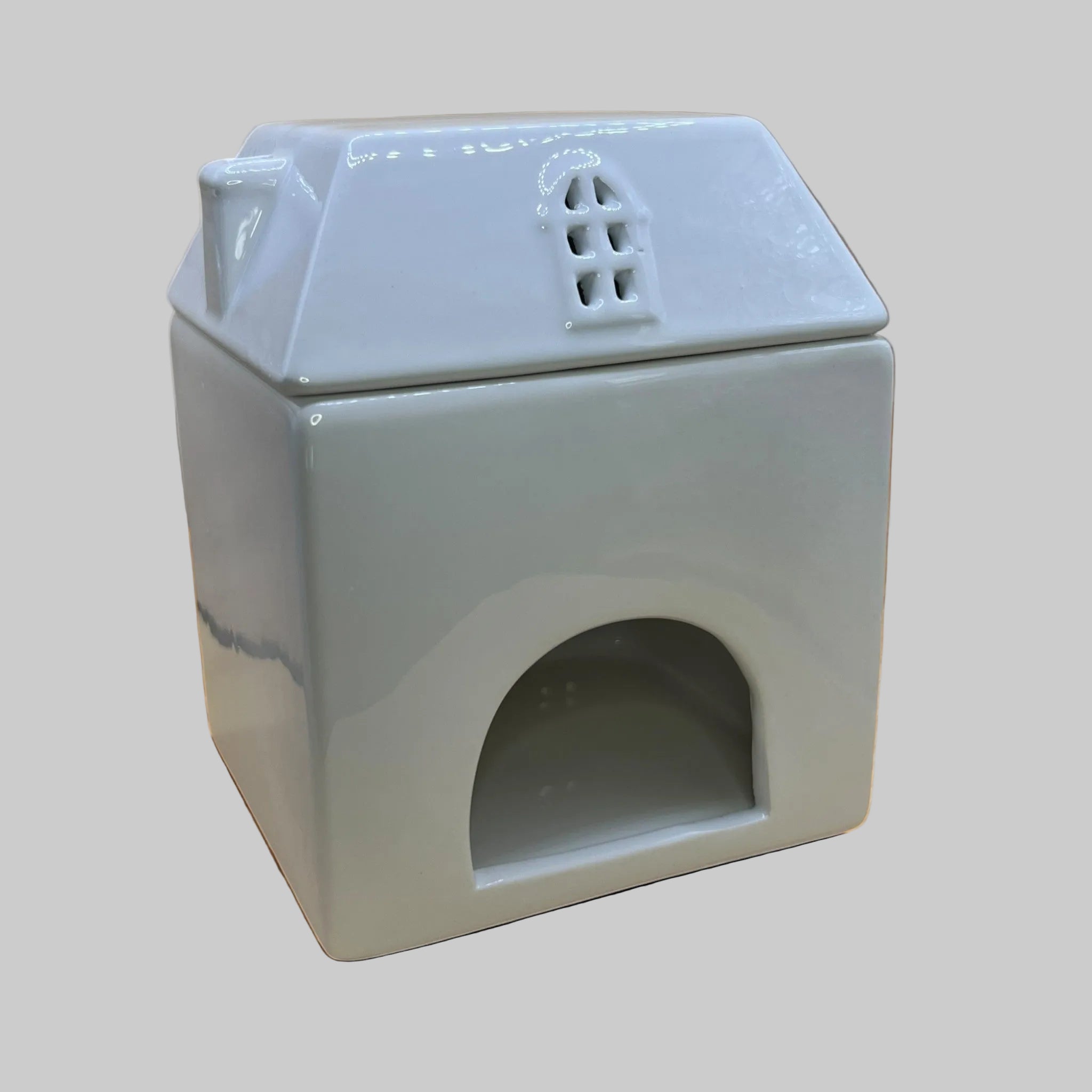 Back view of Country Cottage Wax Melt Burner showing the opening for tealight placement, combining function and charm.