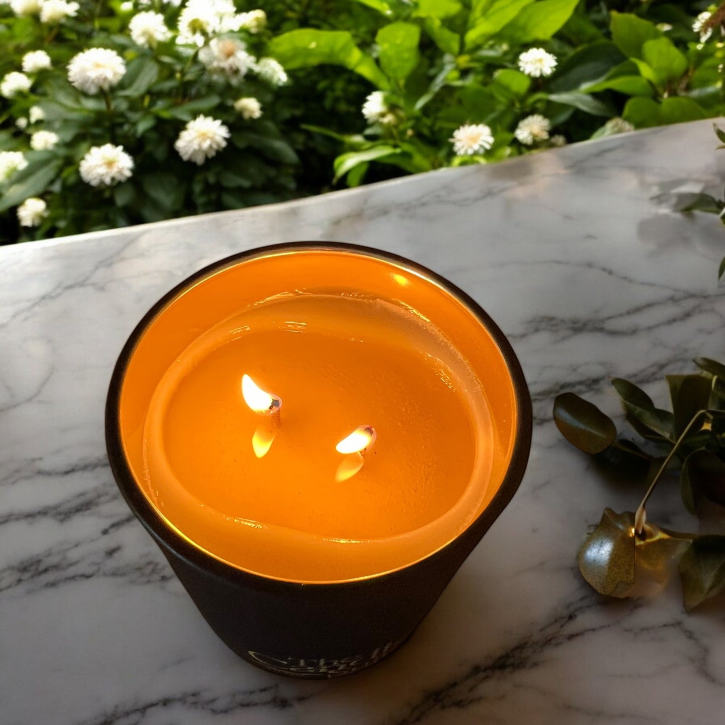 Elegant black matte jar luxury scented candle with a warm, inviting glow