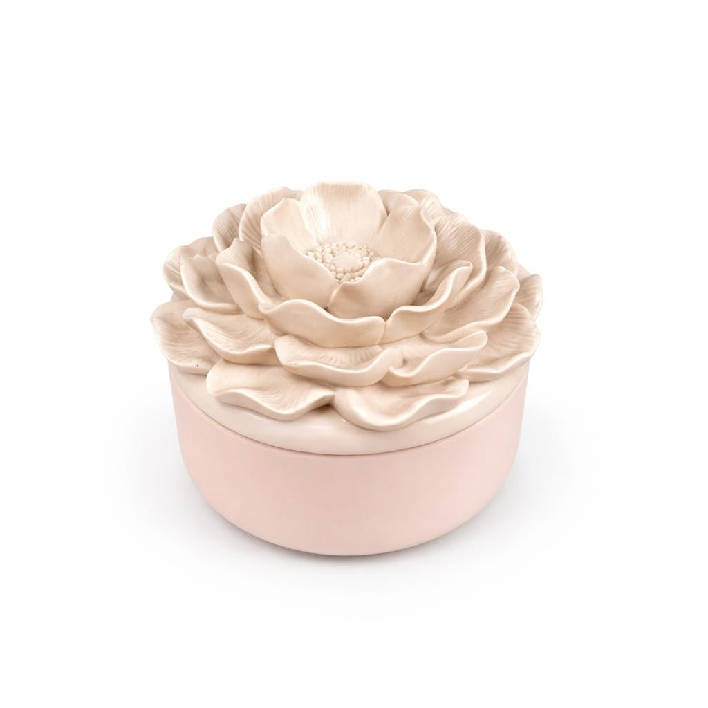 Decorative ceramic pot with floral design on a white background