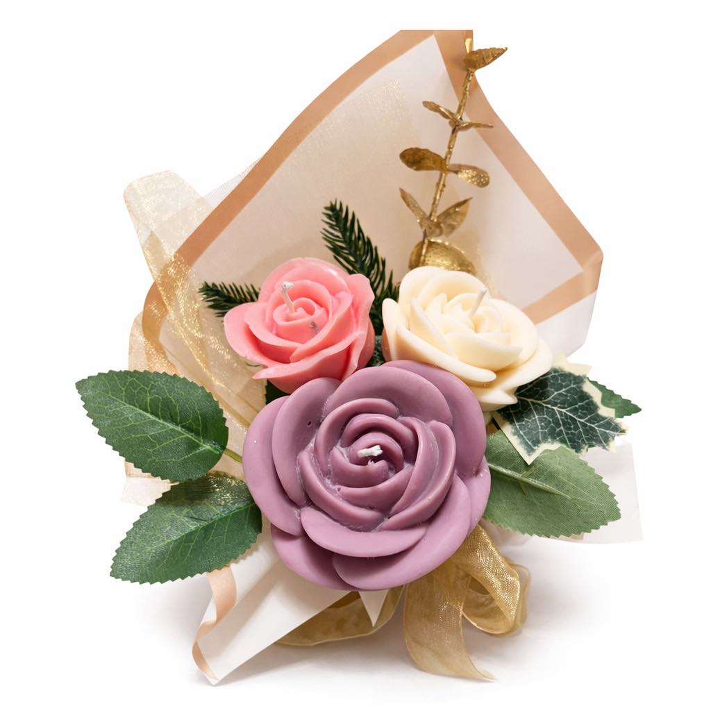 Decorative flower arrangement with pink, white, and purple roses in a decorative box on a white background
