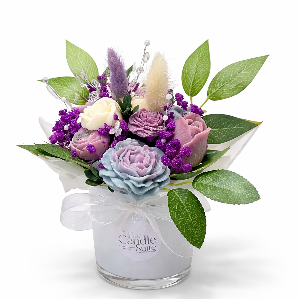 Wax Floral arrangement in a glass mug with a visible brand logo on a white background