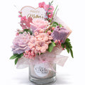 Mother’s Day floral candle bouquet gift with pink and purple wax flowers in glass jar