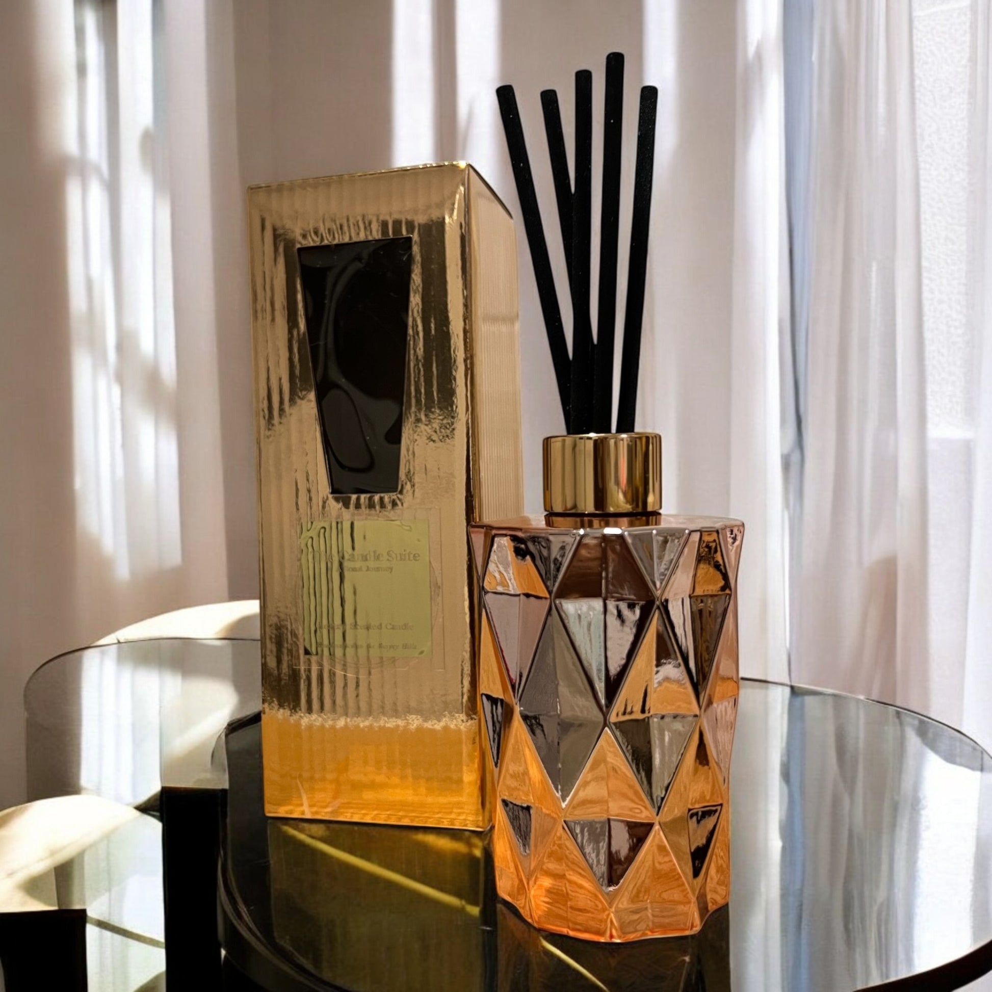 Elegant rose gold bottle of hand-poured reed diffusers, adding a touch of luxury to any space.