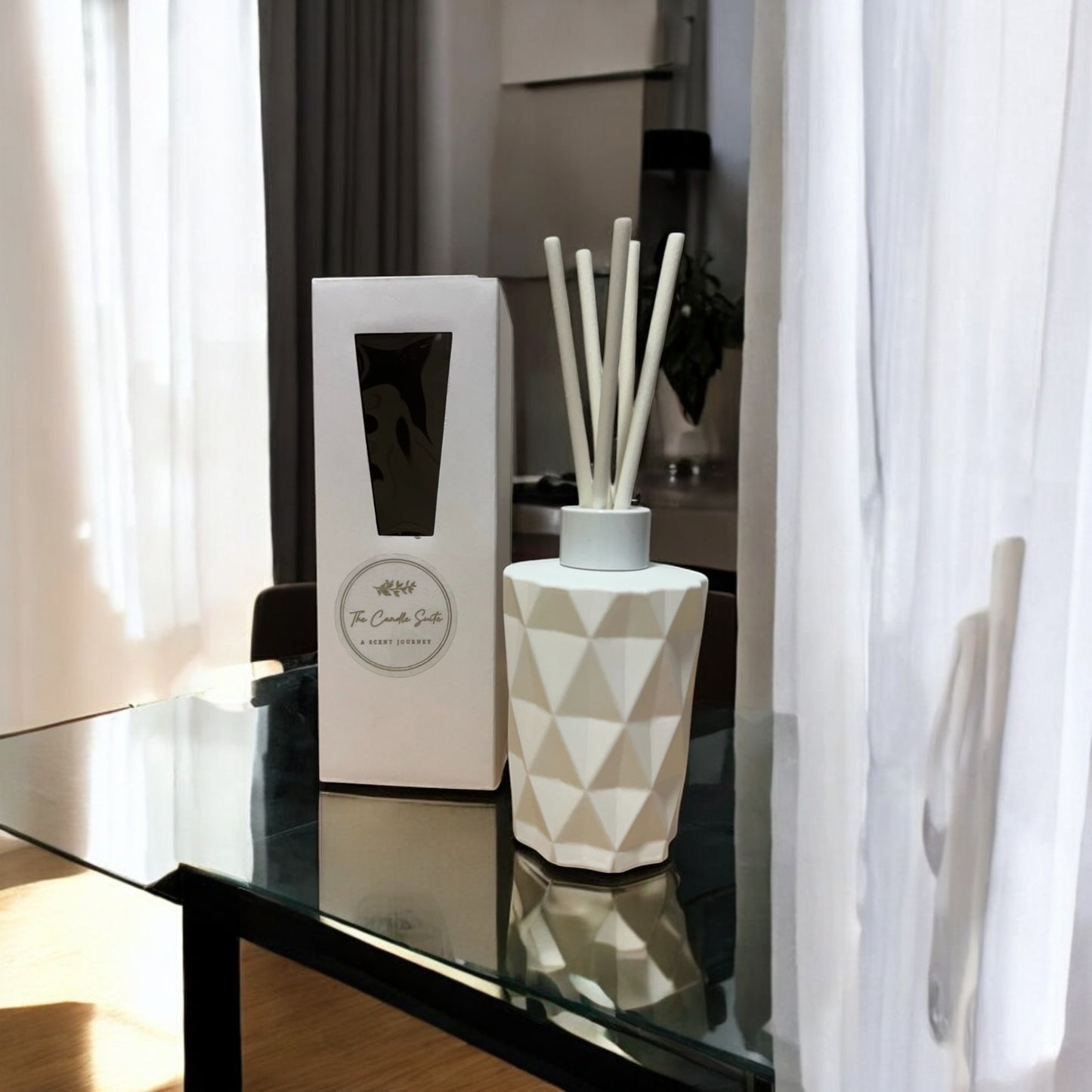 White geometric bottles reed diffusers with delicate hand-poured fragrance, offering a stylish and subtle scent