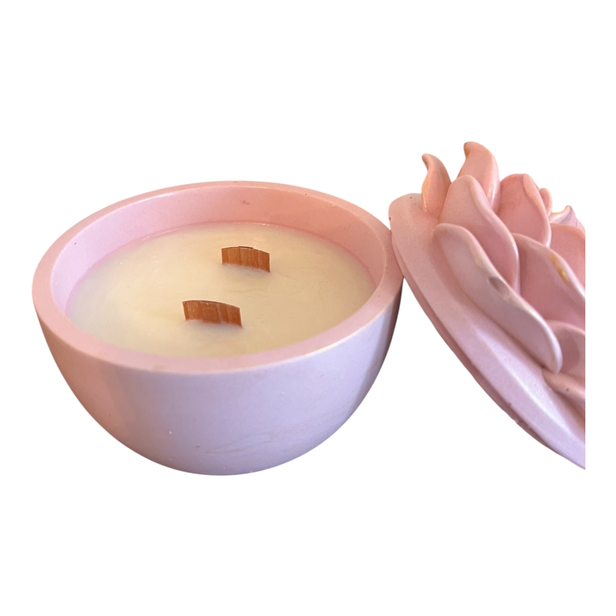 Pink and white candle with decorative elements on a white background
