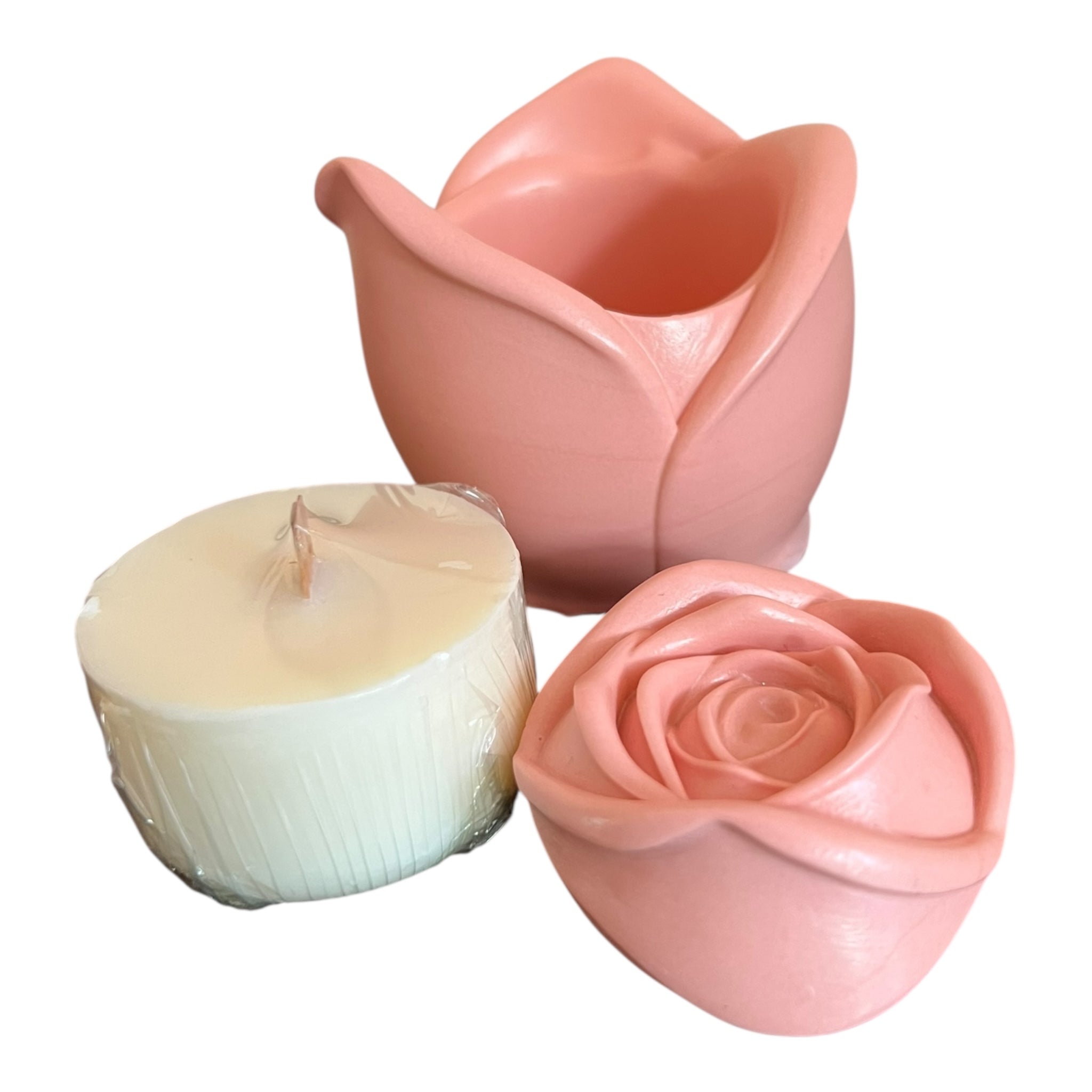 Candle in a pink rose-shaped holder on a white background