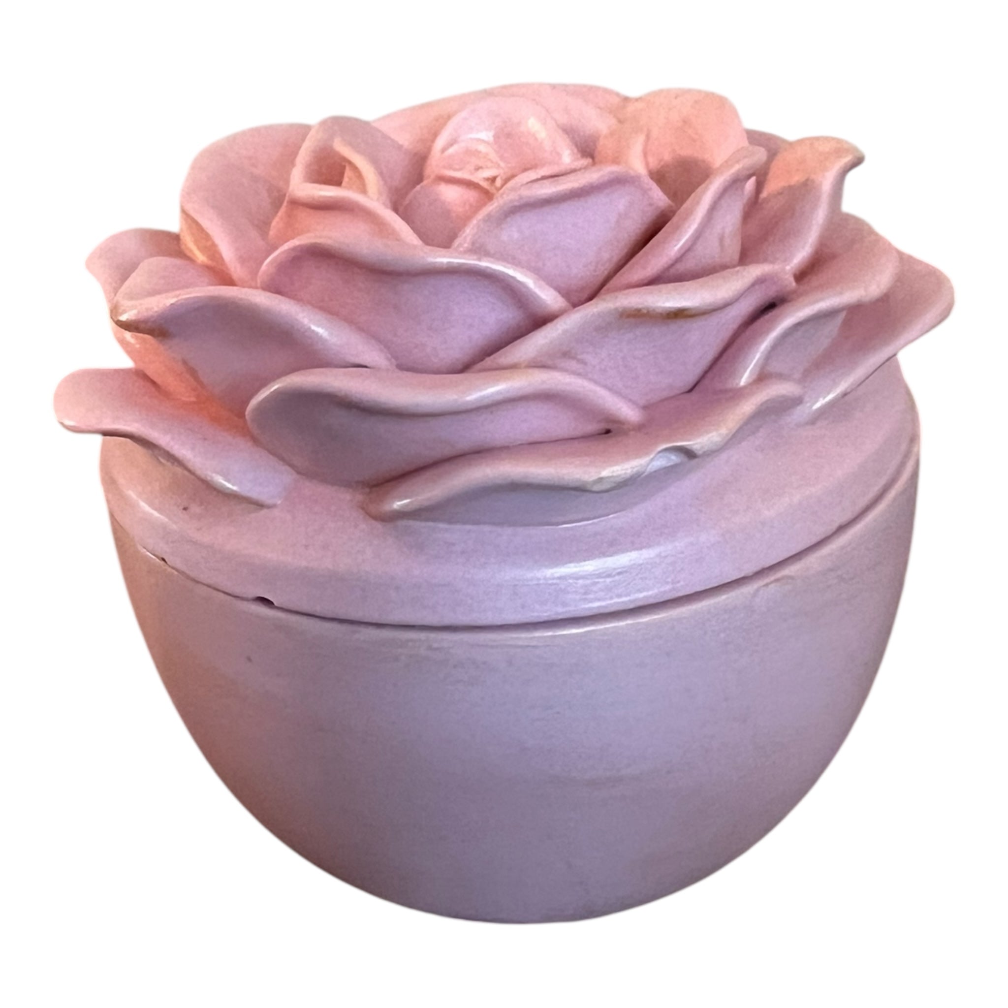 Pink ceramic rose-shaped container on a white background