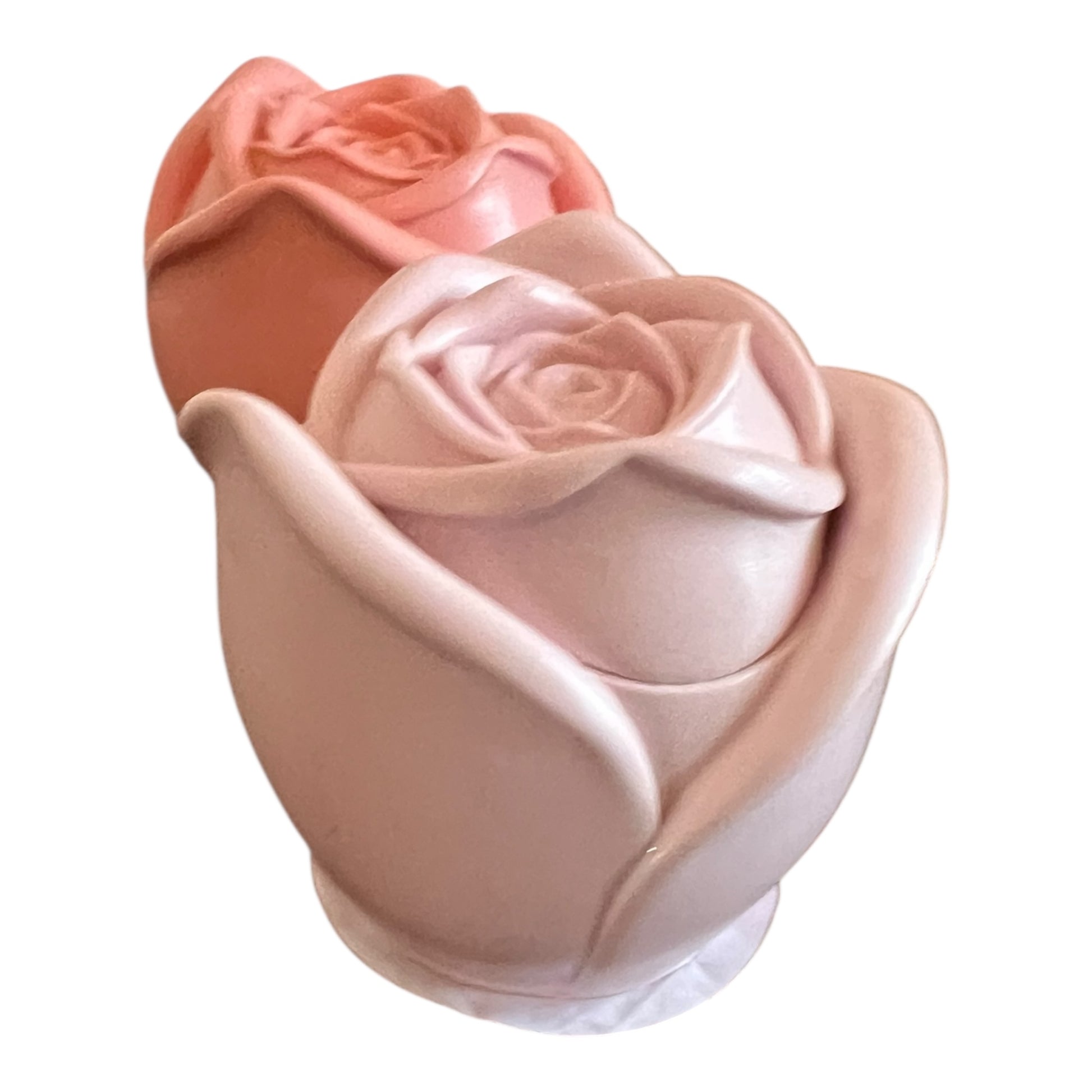 Rose-shaped container with two roses on a white background