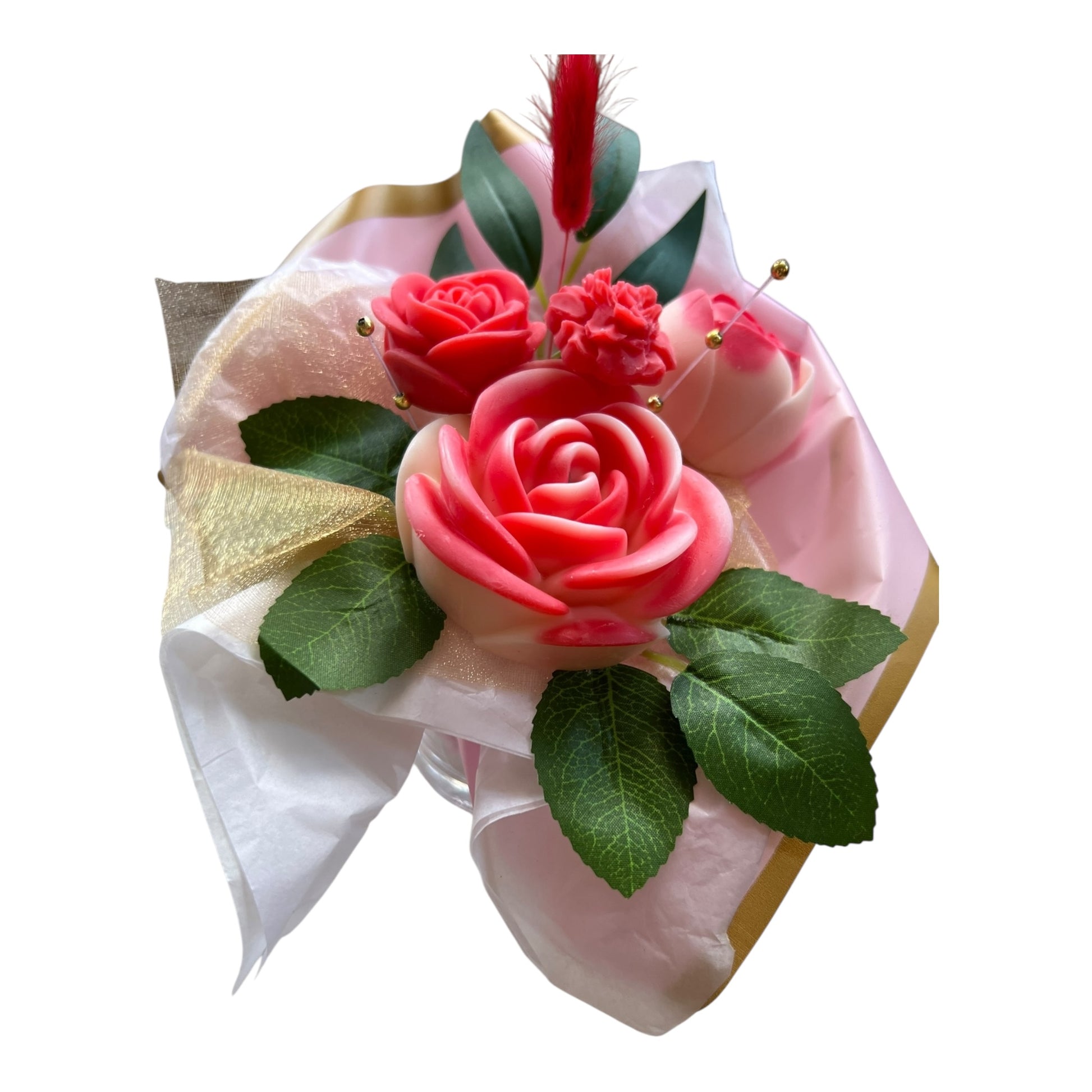 Decorative item with pink roses, green leaves, and a gold bow on a white background