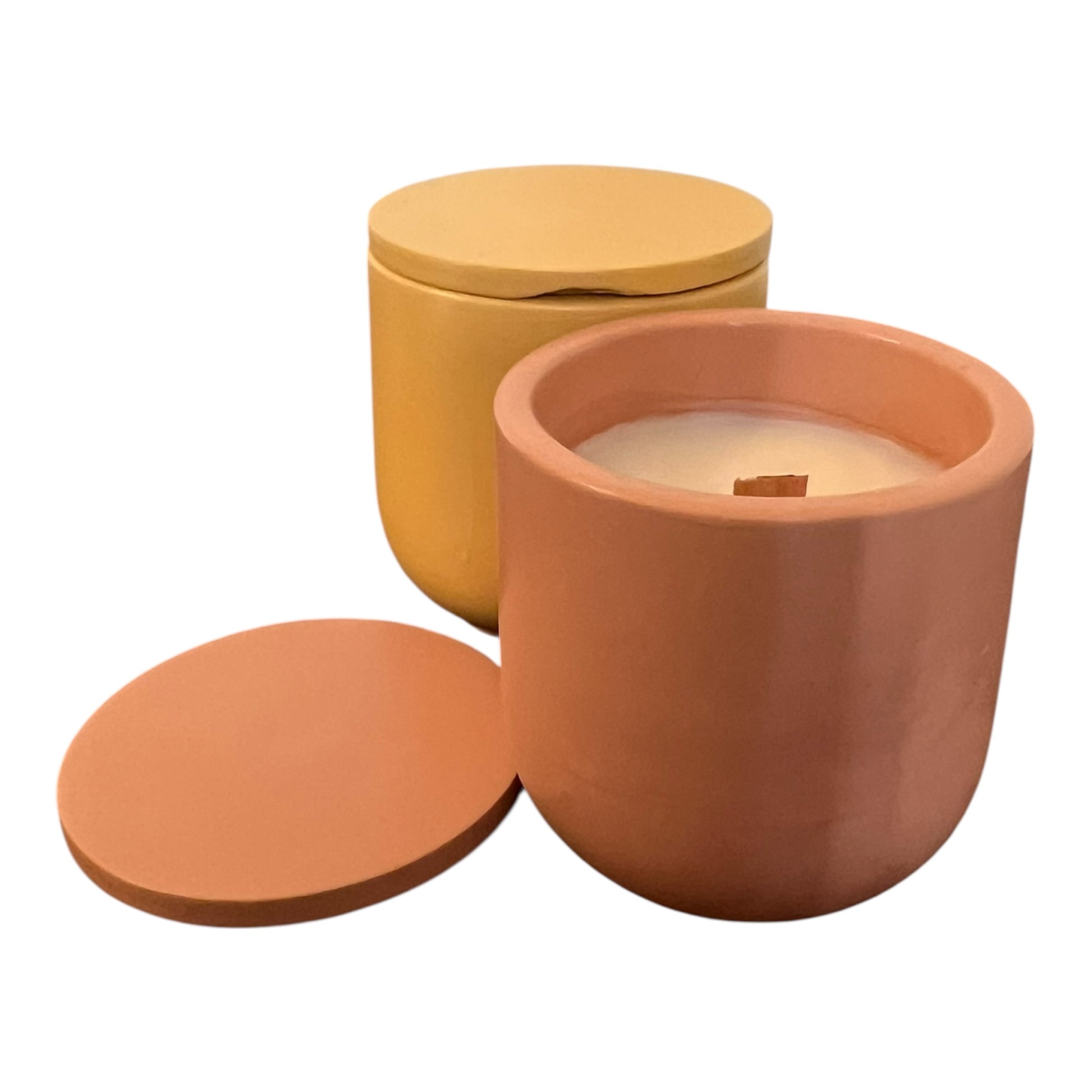Two terracotta-colored containers with lids on a white background