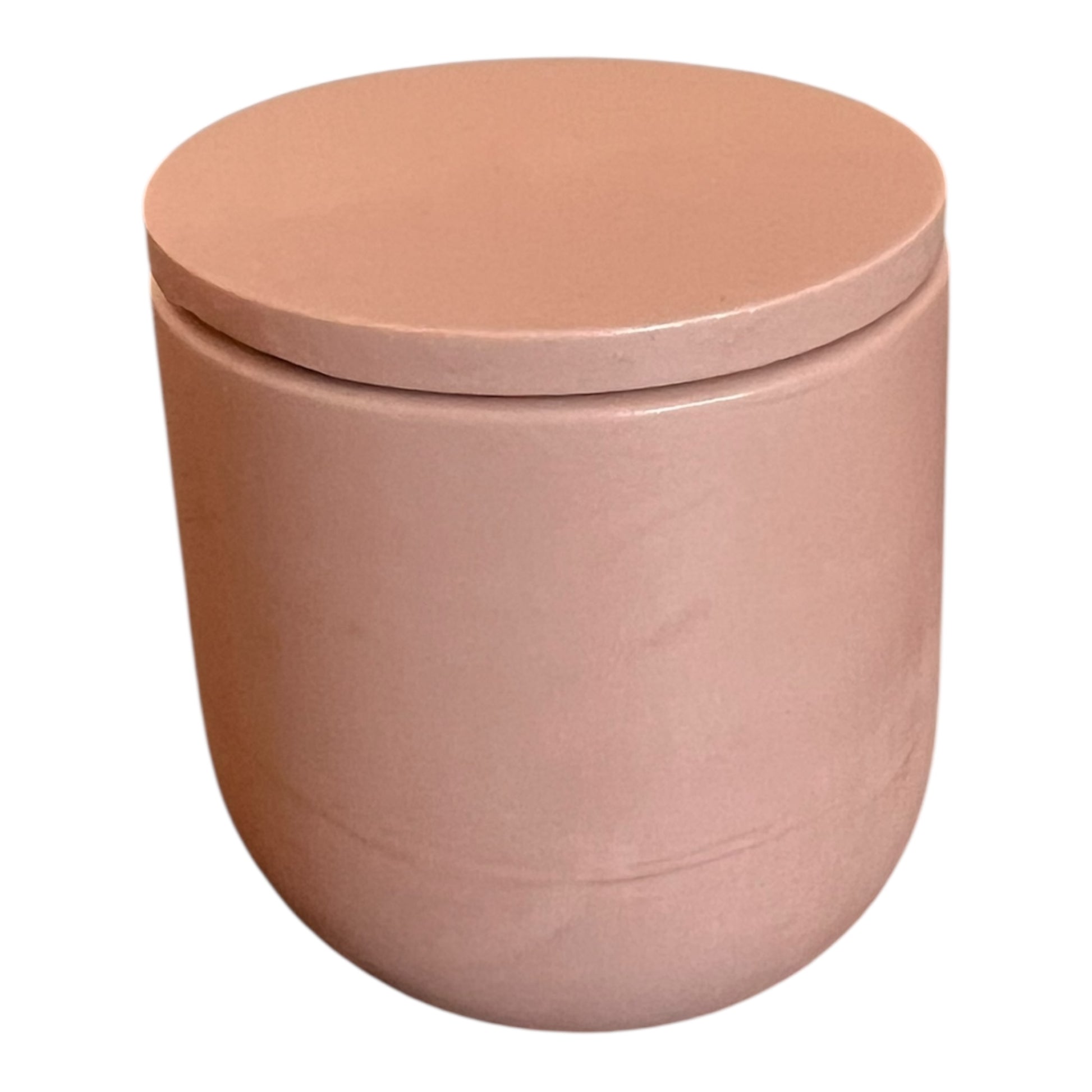 Pink cylindrical container with a lid on a white background