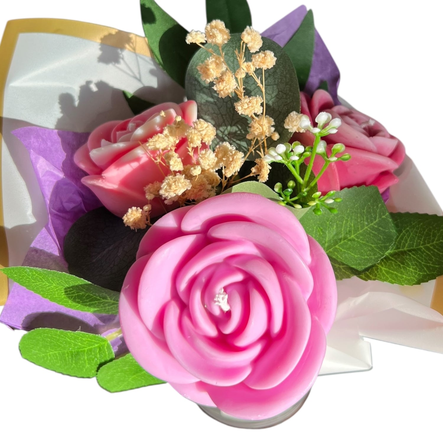 Bouquet of pink flowers with green leaves and baby's breath on a white background