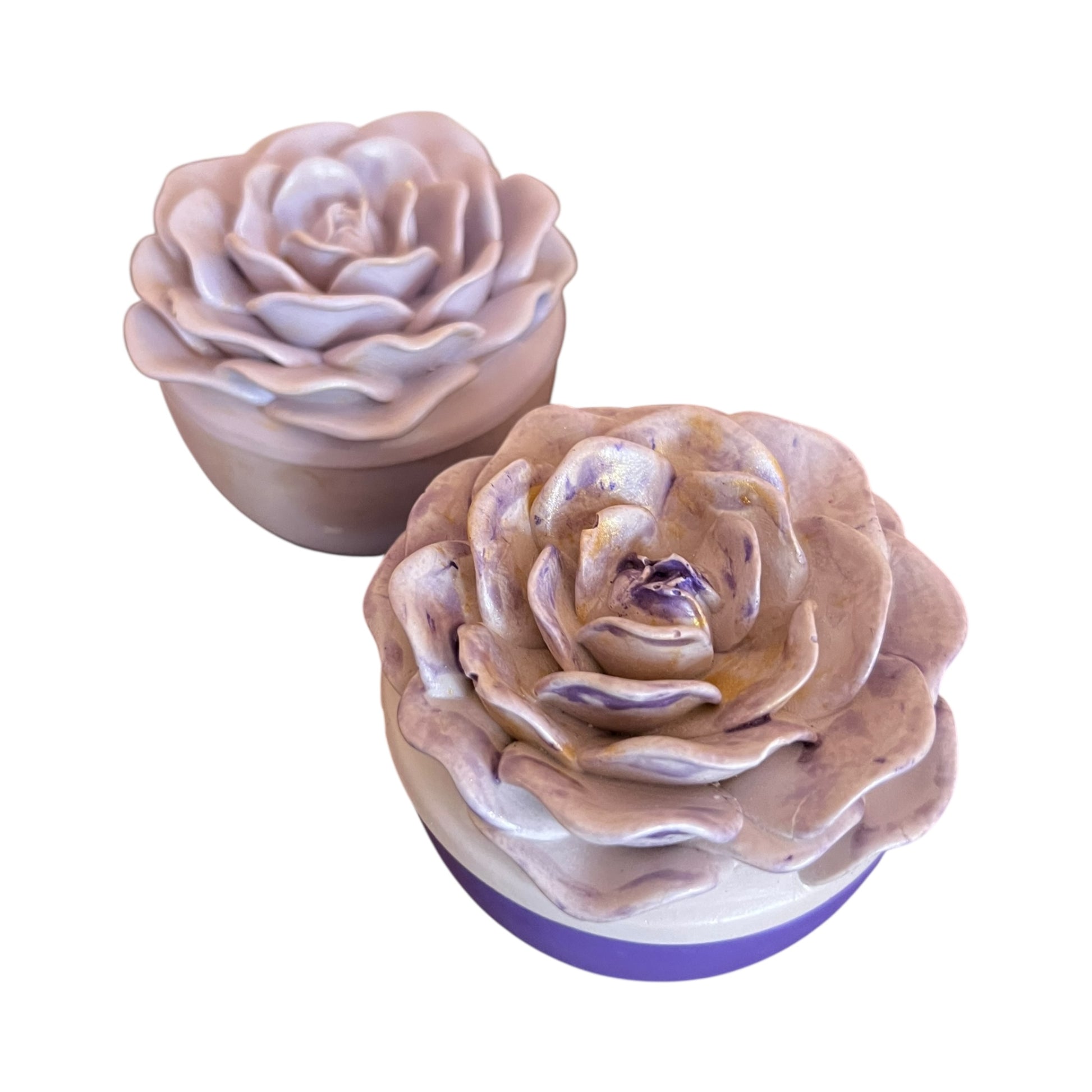 Two rose-shaped soap bars with a gradient color on a white background