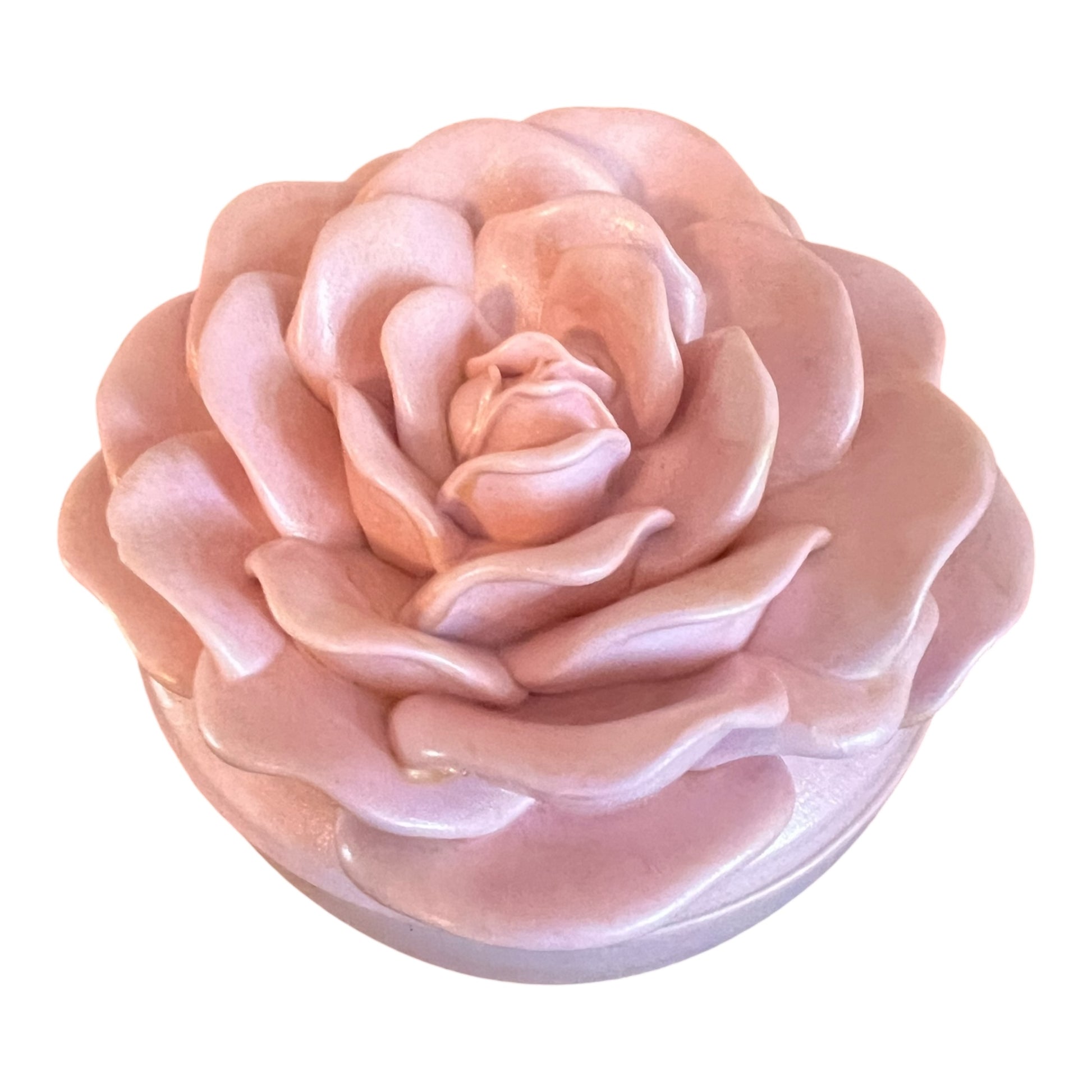 Pink rose-shaped object on a white background
