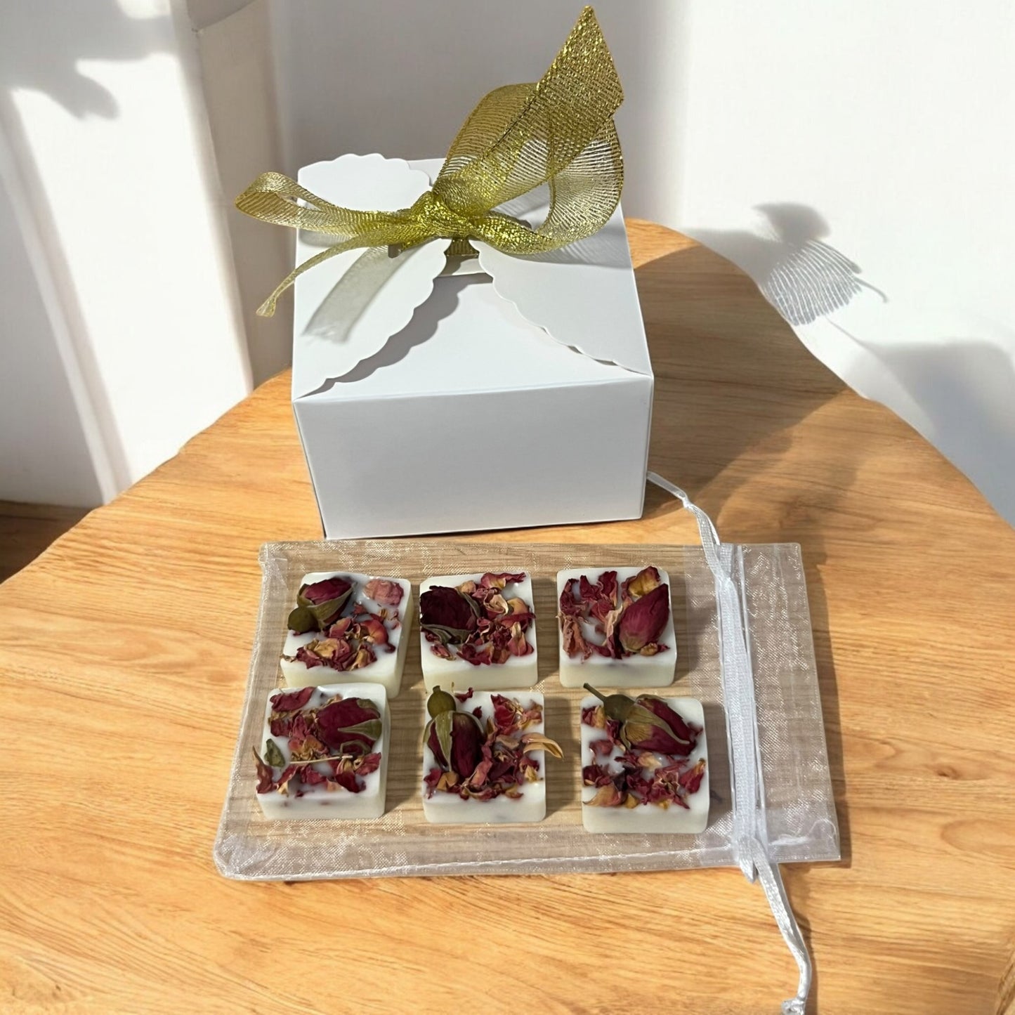 Delicate wax melts with embedded botanicals, releasing a beautiful, earthy fragrance as they melt