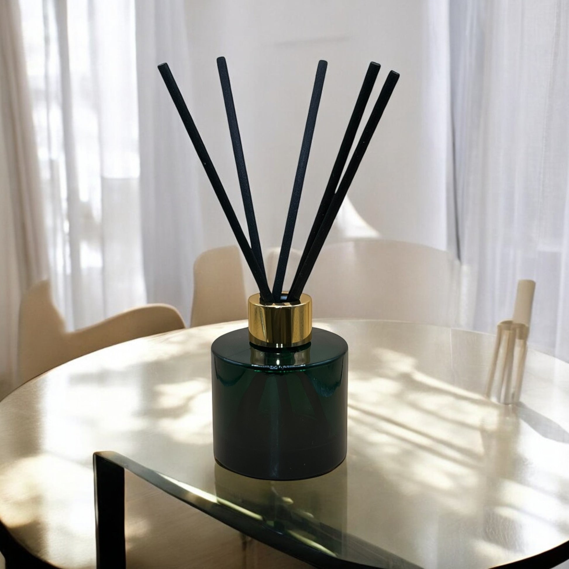 Premium hand-poured reed diffusers in a dark green glass bottle, designed to enhance ambiance with elegance.