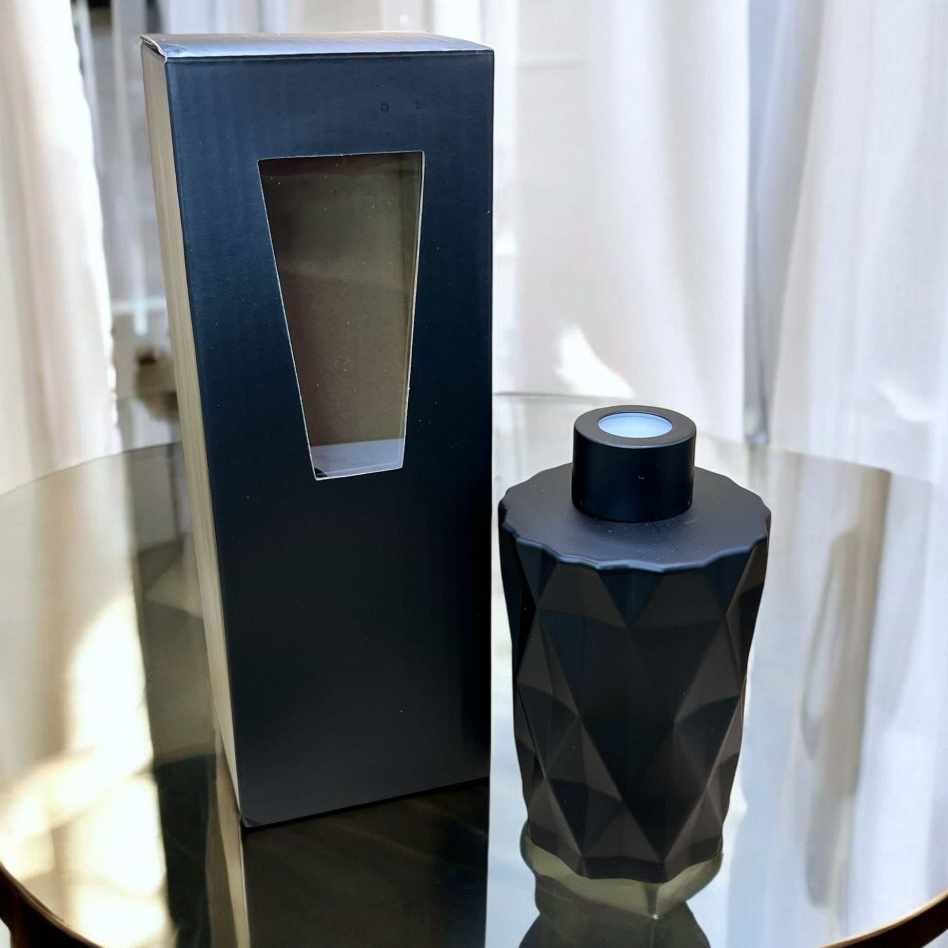 Modern reed diffuser with soft floral scent for a peaceful home environment. Our black home diffuser