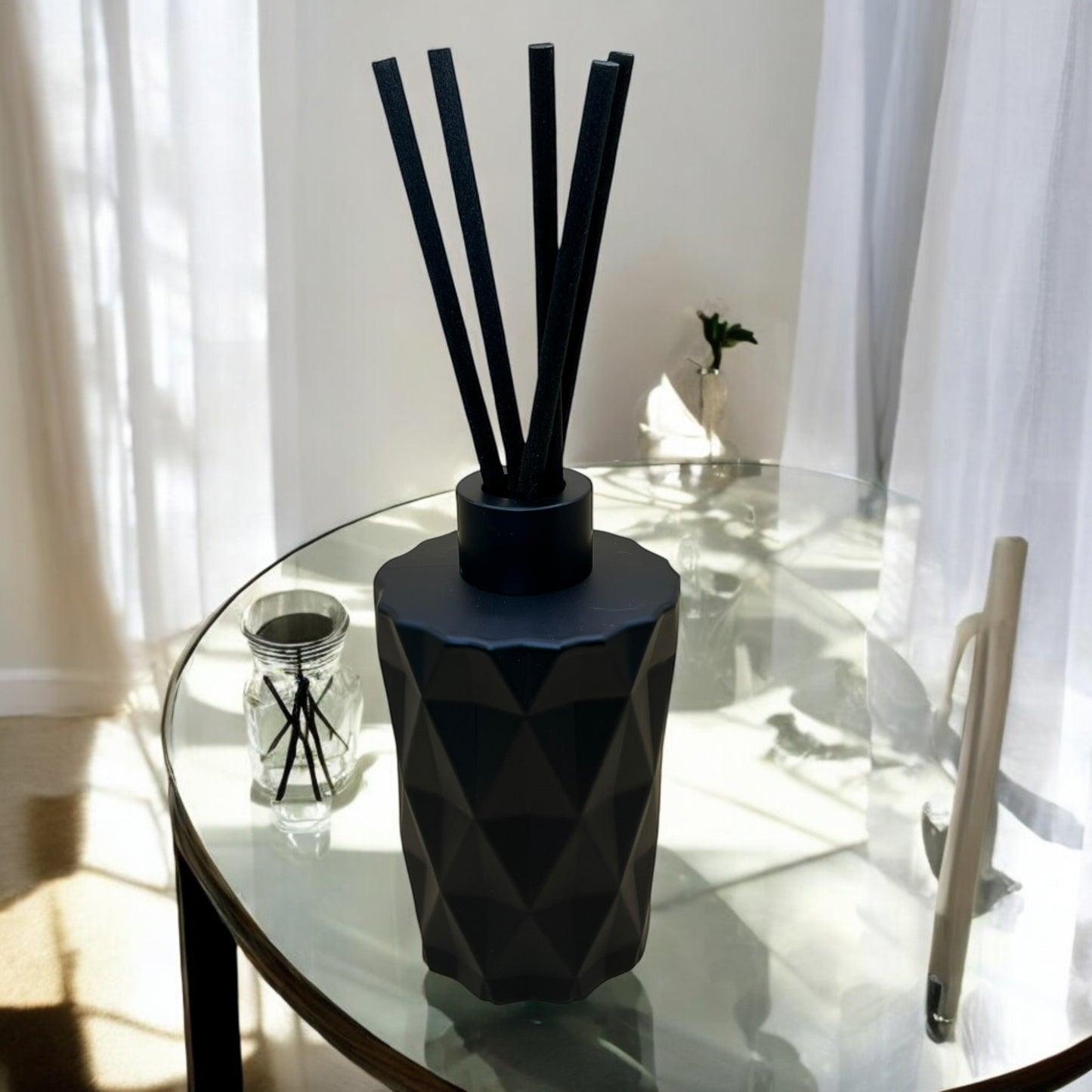 Luxury Reed diffusers in a black geometric bottle for a clean, uplifting atmosphere. Our home Diffusers with black home diffuser sticks