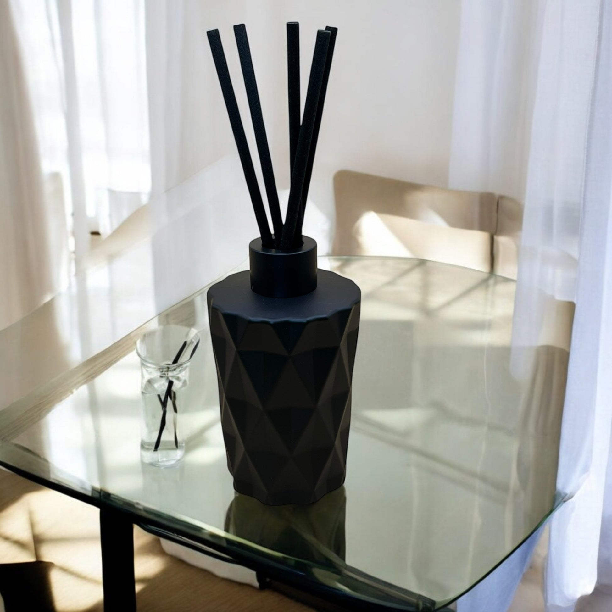 Decorative reed diffuser in minimalist design, filling room with citrus note